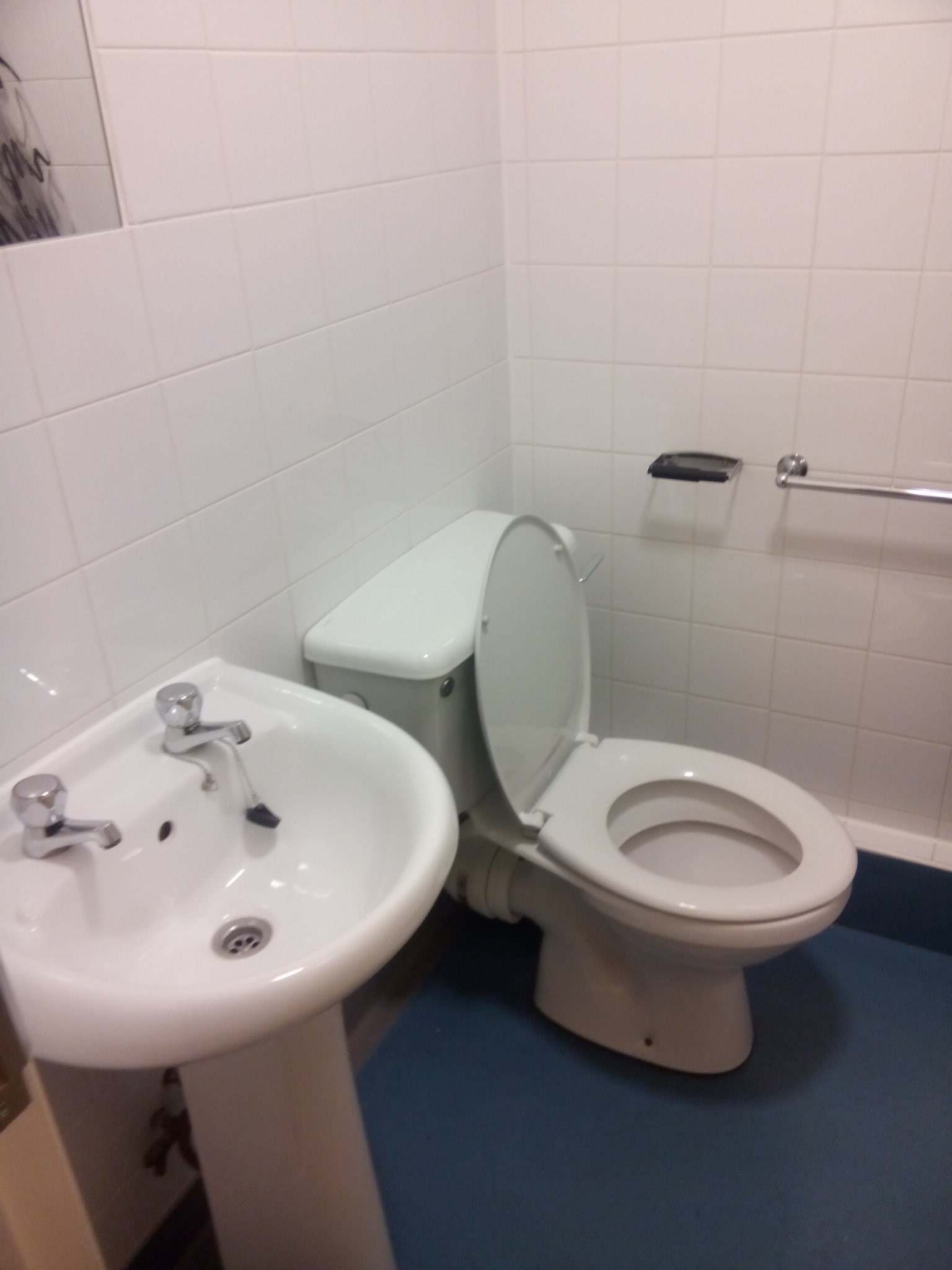 En-suite bathroom showing sink, toilet and towel rail. All bedrooms are en-suite.